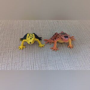 Two Plastic Frog Toys